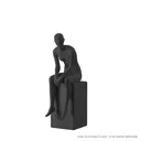 Black mannequin, female, urban style, abstract head, seated pose 001