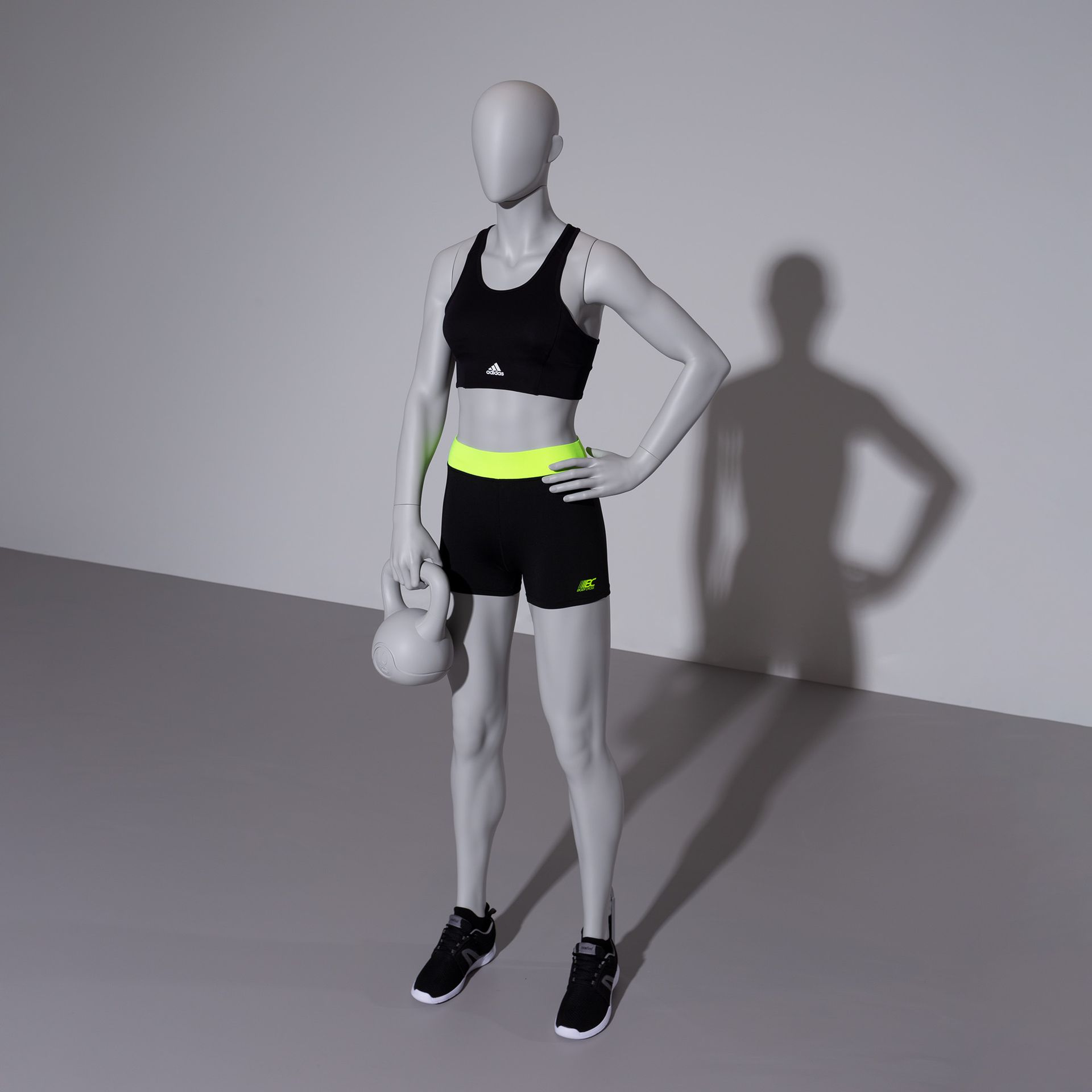 Kettlebell fitness mannequin, female, grey, abstract head, standing pose 11