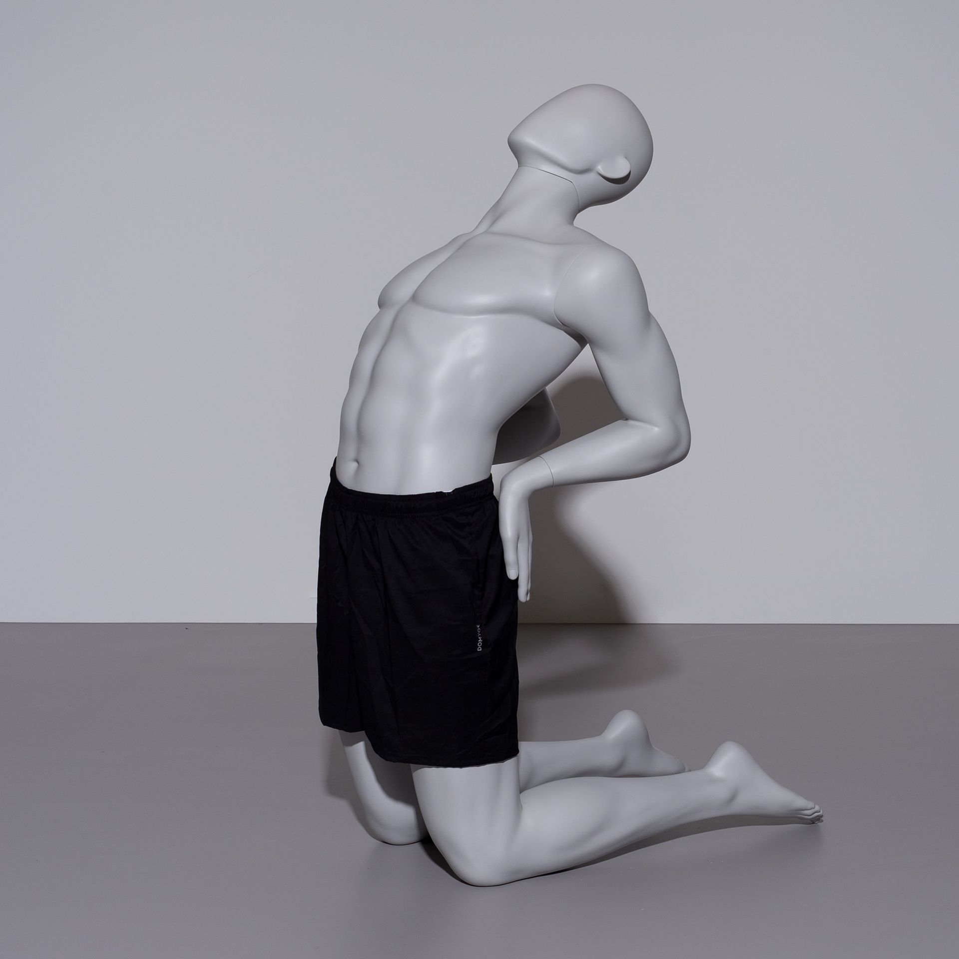 Yoga sport mannequin, male, grey, abstract head, seated pose 307